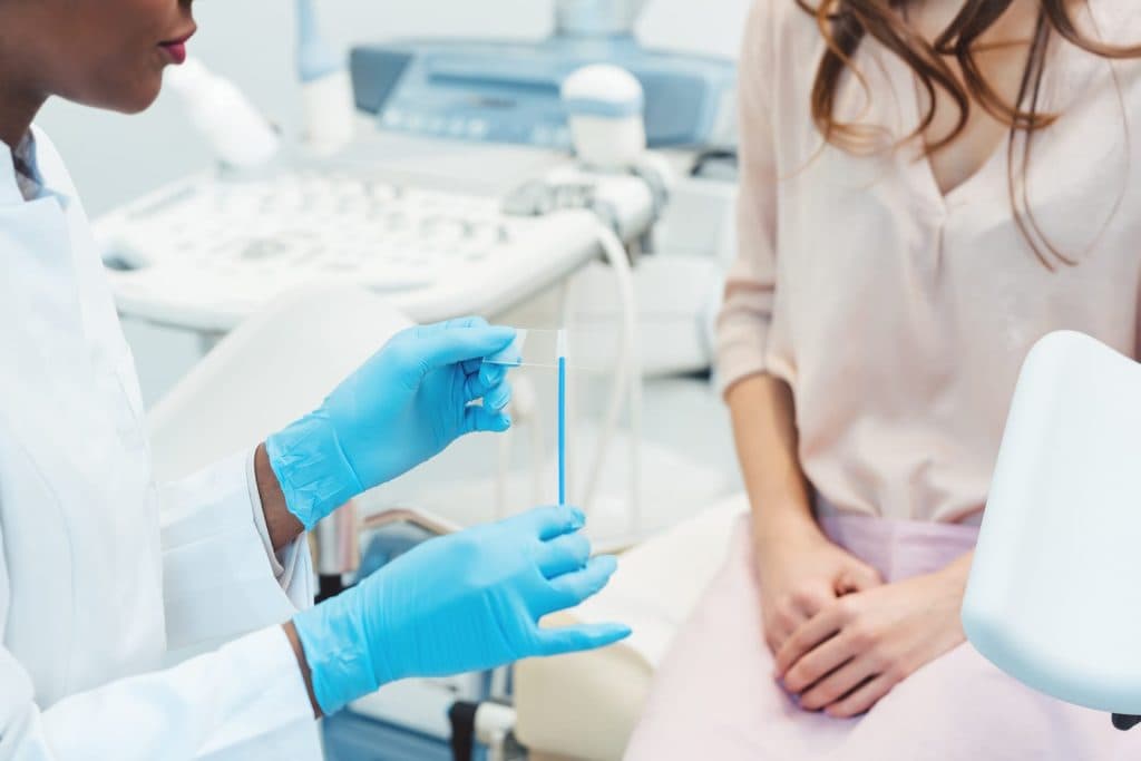 A woman in consultation with a doctor about STD screening